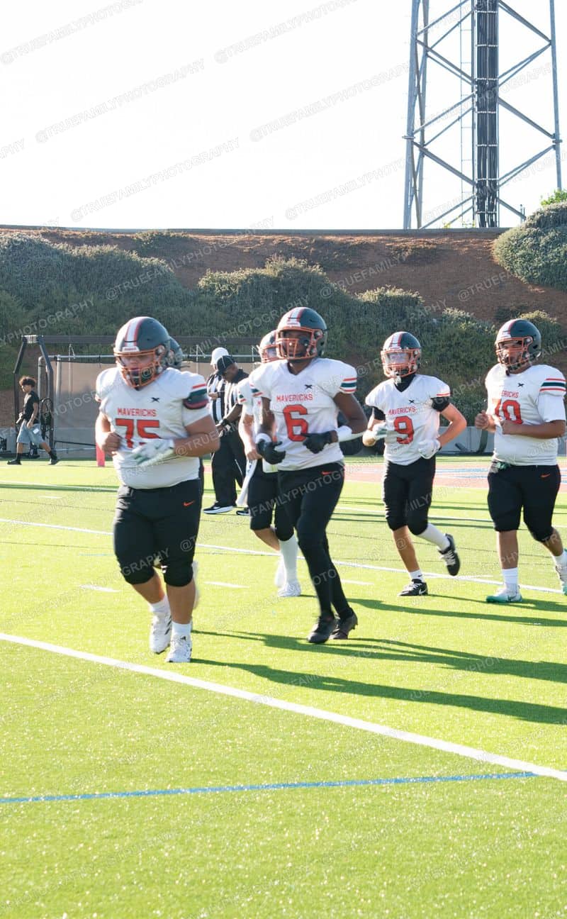 JV #75 Joseph Ambagis, #6 Jayden Wilhelm, and #9 Daniel Munoz take the field at Highlands.