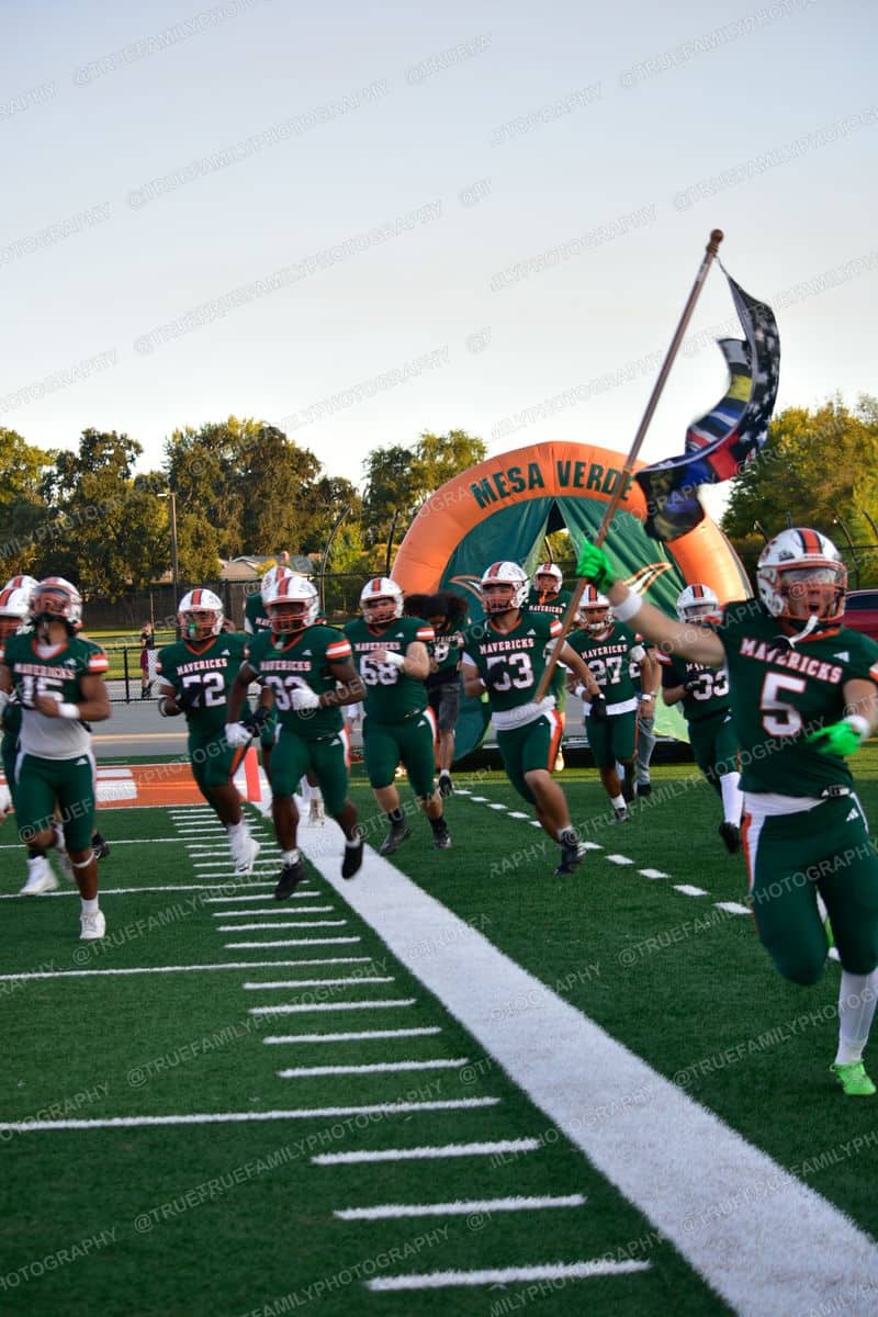 Take the field. #5 with the flag vs Golden Sierra.